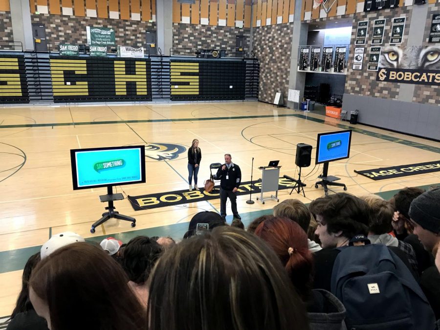 An ambassador of the Sandy Hook Promise Club stands in front of the class of 2018 addressing what it truly means to, “Say Something.” The senior class witnessed an informational presentation last Wednesday during the advisory period about what the Sandy Hook Promise is and how to take the first steps to identifying a situation that should be spoken up about in relation to teen violence.