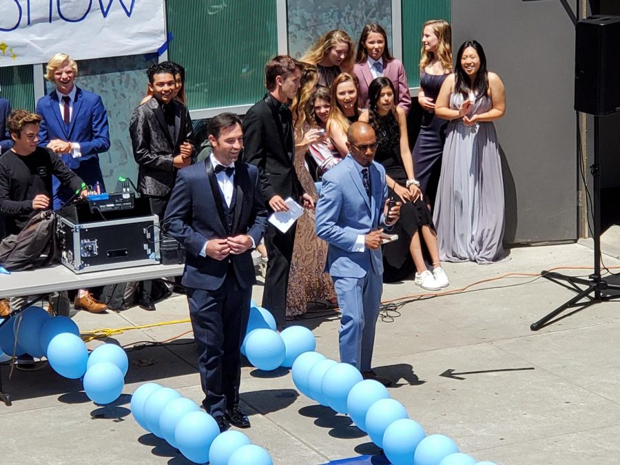 Dan Deleon and Frederick Griesbach prepare to walk down the aisle at Friday’s Prom fashion show.