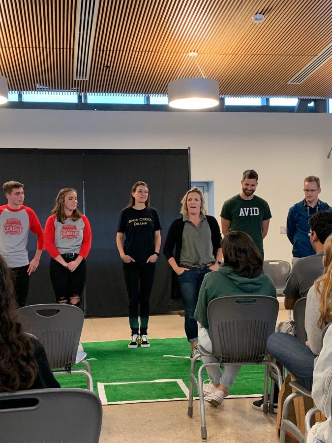 Joe Fox is up on stage during the Staff vs. Students Comedy Sportz held on Thursday in the cafeteria. The game ended in a one-point victory by the students after a close match with the teachers in the lead up until the very end.