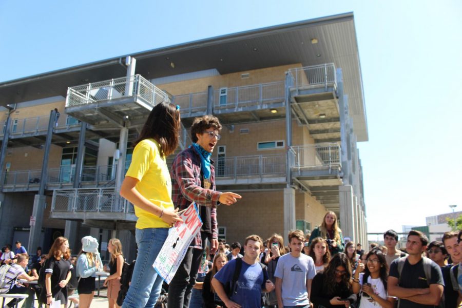 Seniors Samantha Low and Wiley Waggoner give speeches during the Climate Walkout on Friday, Sept. 20. The two students led and administered the walkout. 