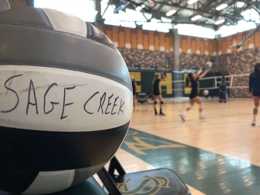 Varsity girls volleyball practices their serving in order to get ready for their game on Monday, Sept. 23. They practiced on Friday, Sept. 20.