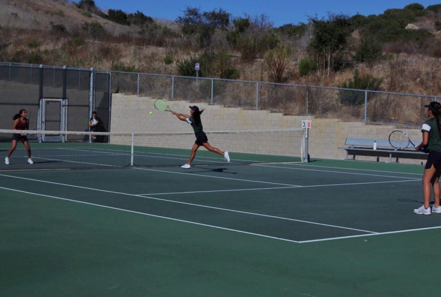 Sophomore Isla Leverette quickly dashes to the net for a strong hit. Girls tennis beat Rancho Buena Vista 3-5 on Oct. 3. 