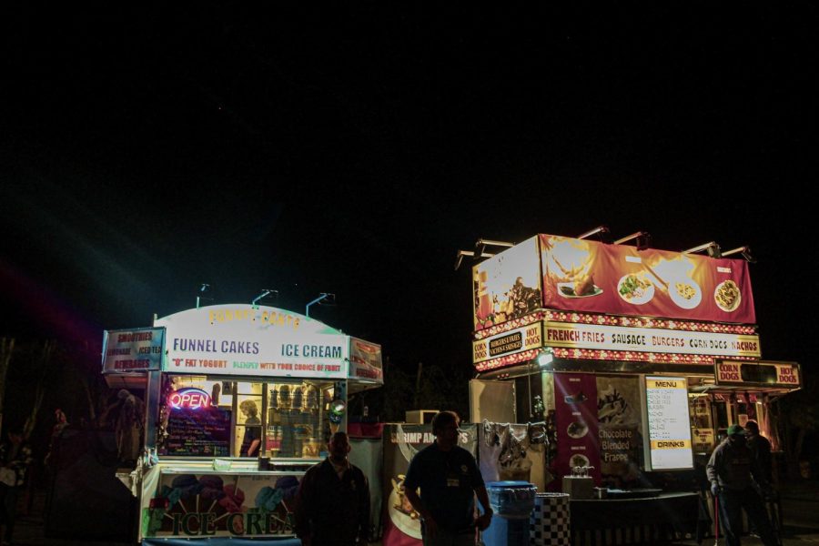 Customers leave with food in hands at the Scream Zone's food stands. These gather tons of customers throughout the night.