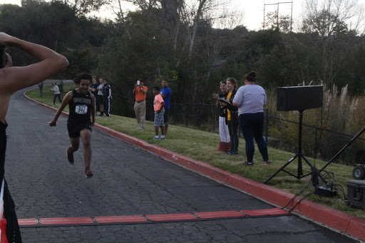 Diego Garcia flies into the finish with a 5k time of 21:04. As he is a senior, this race was his final high school cross country race.