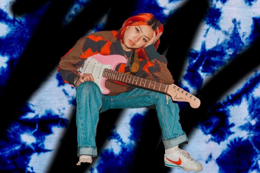 Beabadoobee poses with a pink electric guitar. Beabadoobee started publishing her music in 2017 onto Spotify and since then has toured the world and published an EP titled "Space Cadet".