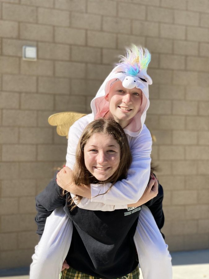 Junior Charissa Feldmann and Sophomore Finlay Hughes pose in their pajamas. In preparation for their game against El Camino, the girls basketball team decided on a theme of wearing pajamas to school.