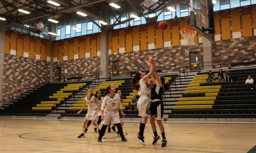 Girls JV basketball play offensively against San Dieguito Academy. The game took place last Friday at home.