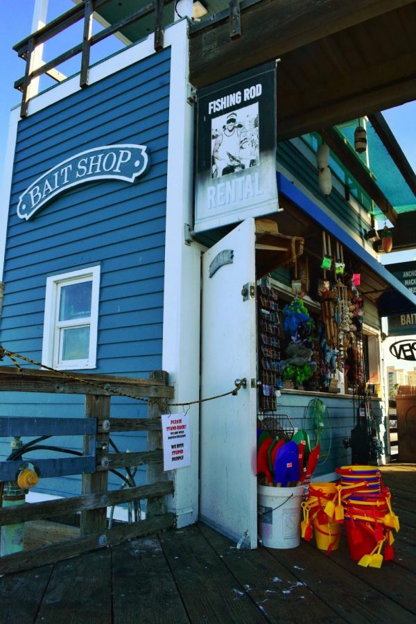 Beach shovels and buckets sit outside the bait shop. Many goods are sold here, such as fishing rods, hot chocolate, ice cream and (no suprise here) bait for fishing. 