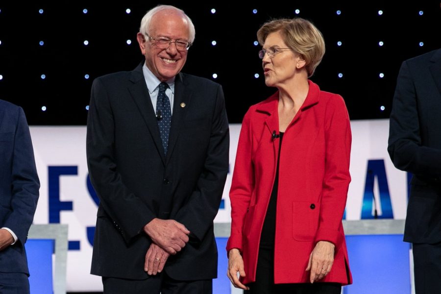 Senator Sanders and Warren talk and laugh at the July 30-31, 2019 Democratic debate in Michigan. The next debate will be held March 15, 2020.