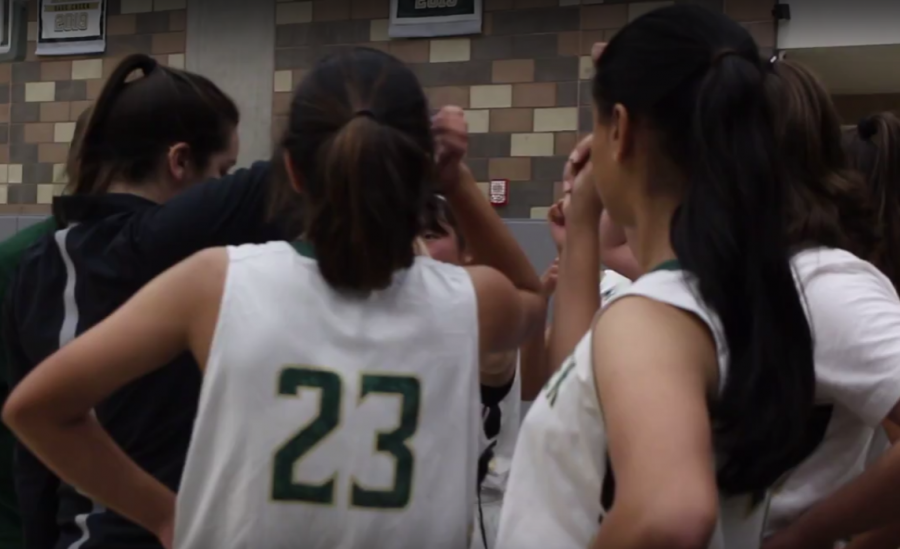 Girls JV basketball faces off against Oceanside, huddling up at halftime. The players fought hard but lost 36-40.