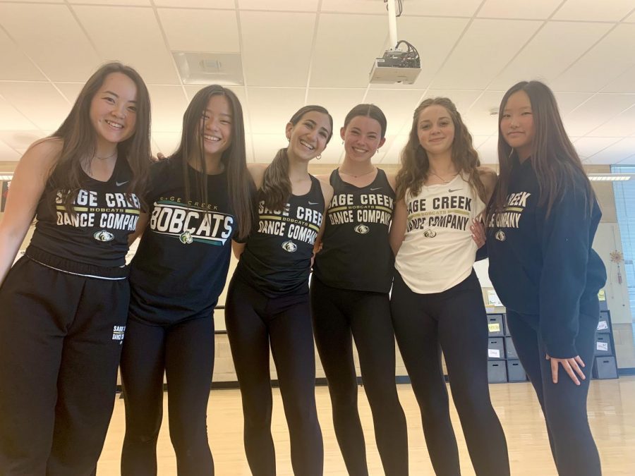 Sage Creek dance company poses for a photo. Dance company has been diligently practicing throughout the basketball season to perform at half time shows and continues to practice for their spring dance show. 