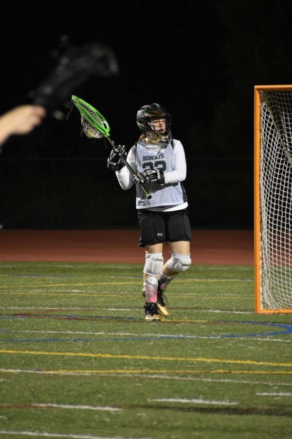 Senior Kaitlin Navarro looks to an open teammate to pass the ball away from the goal. The Bobcats won their game against Fallbrook 14-8. 
