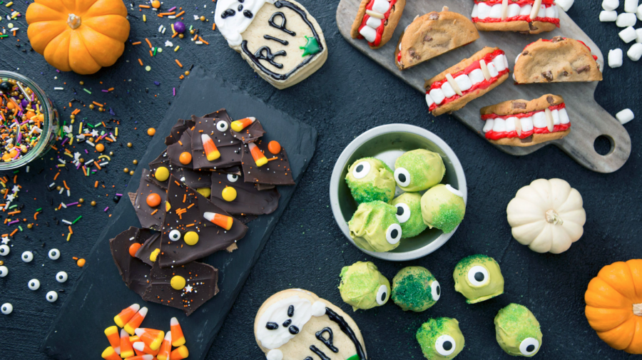 An array of extravagant Halloween snacks ready to be eaten. Halloween is the perfect occasion to bake using new, festive, recipes.