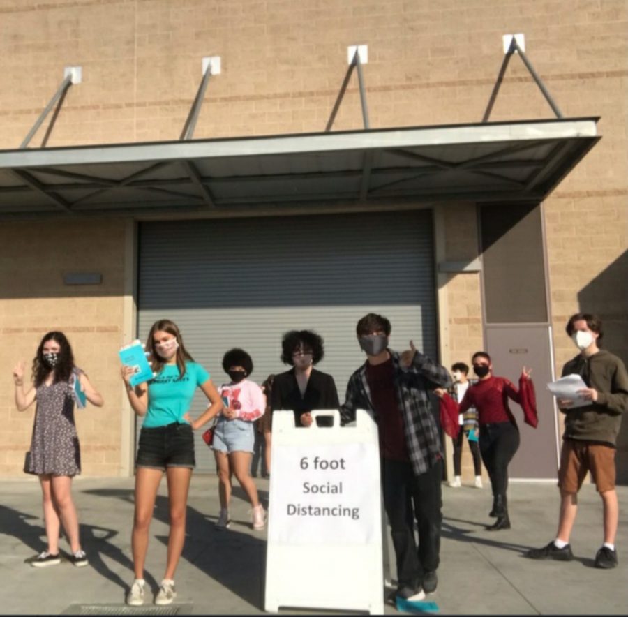 Theater students of Sage gathered in Sage campus to practice Pride and Prejudice play. They keep 6 feet apart and wear masks. 