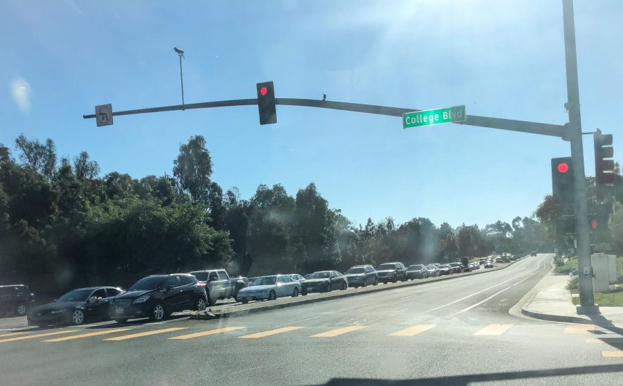 Cars filled with Sage Creek seniors are waiting at the stoplight to attend the Senior Car parade. Sage Creek High School hosted a car parade to distribute “Class of 2021” lawn signs in efforts of boosting morale as college application season ends.