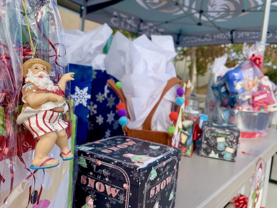 An ornamental Carlsabd santa hangs from a gift bag. As part of the event, all teachers who stopped by for a treat were entered in a raffle for a chance to win one of the wonderful baskets made by PTSA. The baskets contained games, gift cards, and lots of fun holiday decorations. 