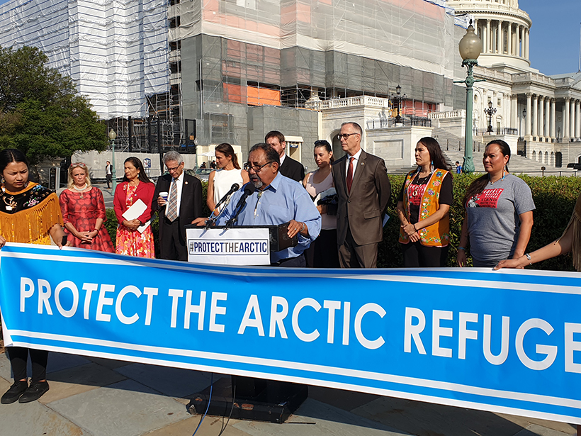 Members of Congress and members of the Gwich’in stand in solidarity against oil drilling in the Arctic Wildlife Refuge.