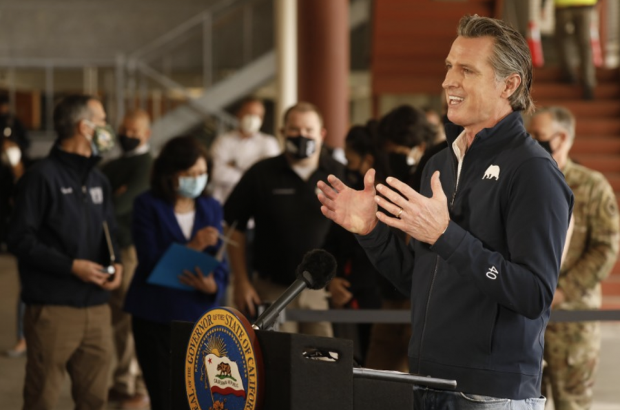 Pictured at a vaccination site, California’s governor, Gavin Newsom announces that he and legislators have agreed upon a stimulus package for Covid-19. The distribution of the Covid relief package however, is going to those who need it most first and then forth throughout the legible groups that can receive the stimulus check.