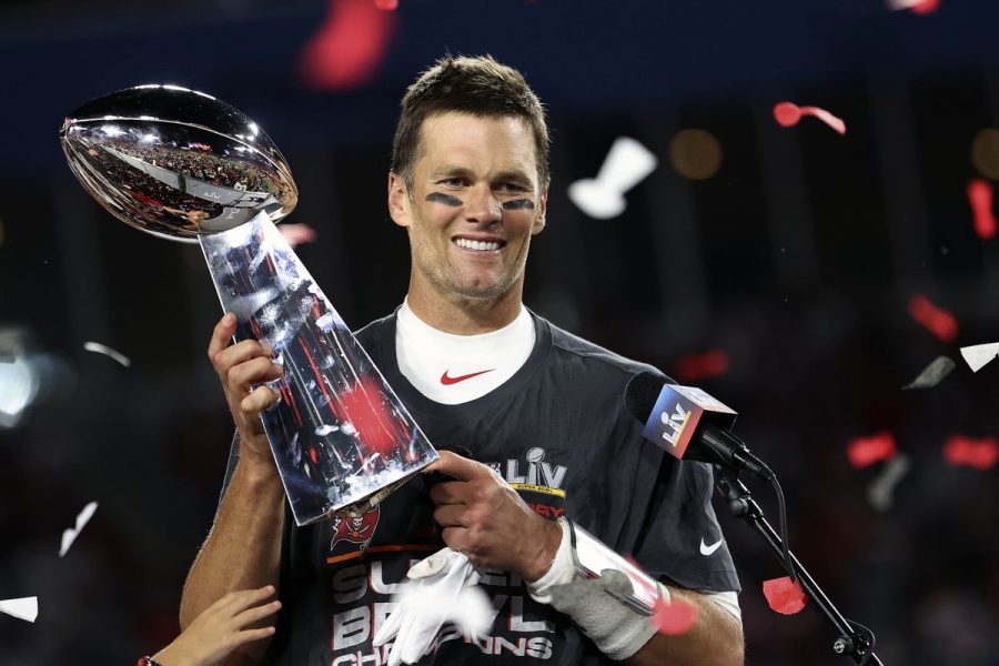 Buccaneers Quarterback Tom Brady holding up his Super Bowl Trophy after beating the Kansas City Chiefs 31-9. This gives Brady his seventh super bowl win. At forty-three years old, Brady has had one of the best careers a player can have and has said he has no intention of retiring. 