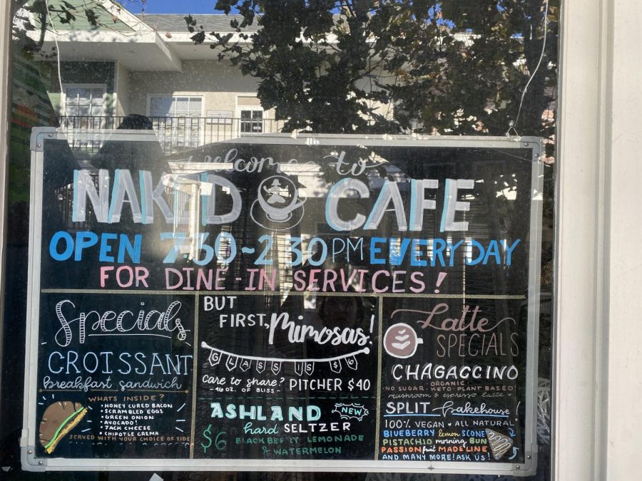 The Naked Cafe menu is on display, showing their specialization in mouthwatering breakfast and lunch food. They are open from 7:30 to 2:30 each day and they are ready to welcome you into their restaurant!