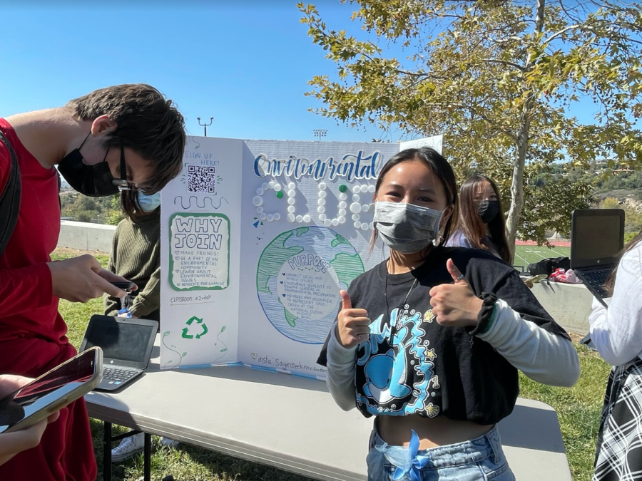 Environmental club leader, Aria Phan, poses with two thumbs up. Environmental club will be holding volunteer opportunities that help the environment for Sage Creek students.