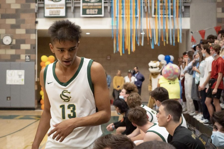 Senior, Vishal Jayanthi walks past his teammates after being subbed out. The boys fought hard in Friday's game with the support of many students and parents watching in the stands. 