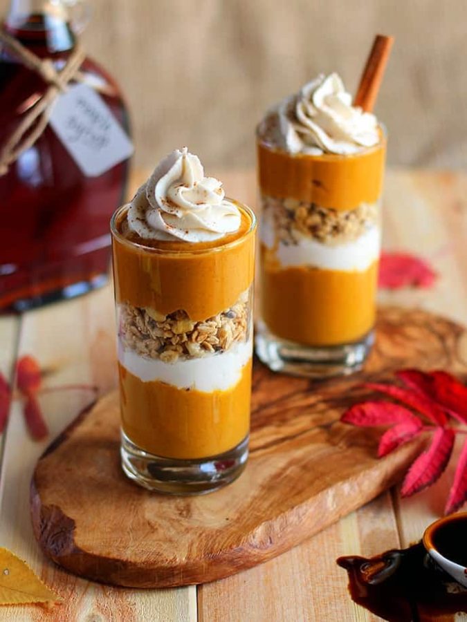 Two pumpkin-pie parfaits, made to perfection, lay on display. The recipe is simple to execute and delicious to enjoy. 