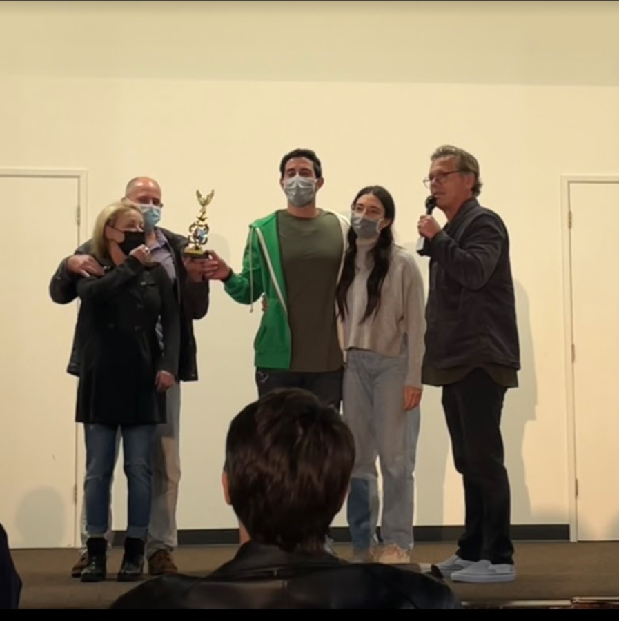 The couple on the left receiving their trophy of victory in the scientific olympiad against the couple on the right. The olympiad was pretty intensive and tricky. 
