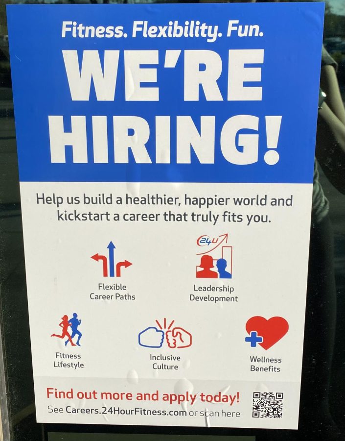 “Were Hiring!” appears on a store window, asking for workers. If you see this sign somewhere you would like to work, apply!