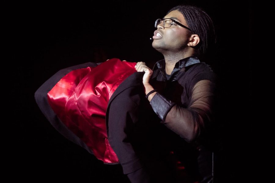 Senior Christian Isaiah Dorsey-McQueen performs ‘Cell Block Tango’ while holding a striking red-lined jacket. The Sage Creek Drama Department delivered a captivating visual performance with a mixture of dark lighting and highly visible red highlights.