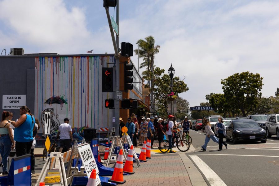 Crowds flee towards the Carlsbad Village Street Faire on May 1. The faire displays were spread all around the village, closing six main streets and alleys. 