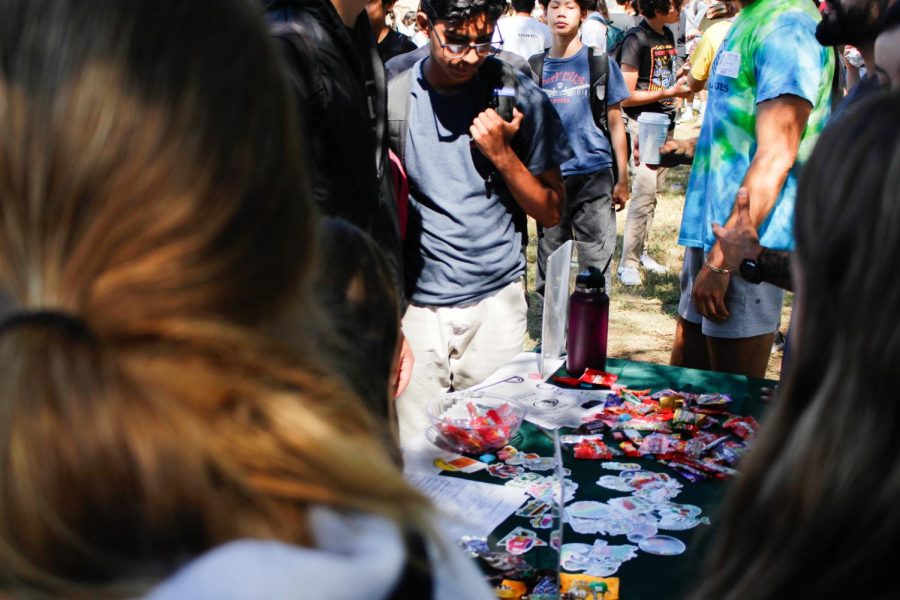 The Boys and Girls Club of Carlsbad hosts a booth at club rush. Throughout the week, the organization filled its table with candy, stickers and sign-up sheets.