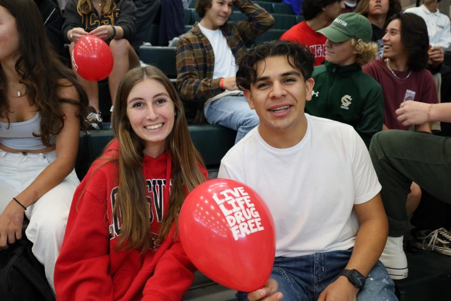 Natalia Fanucchi and Davian Rangel, ASB seniors and bobsquad presidents, pose with a red balloon that says “live life drug free.” The two incentivize school spirit and participation, evident in their involvement at the assembly.