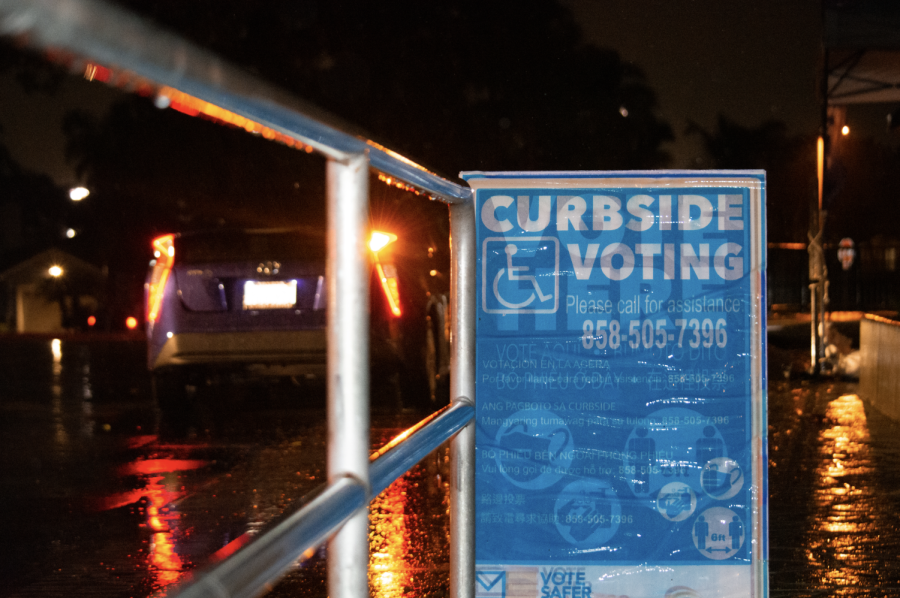Cars line up along the curb at Pacific Rim Elementary School’s polling station. Poll workers aim to make voting as convenient as possible to encourage citizens to exercise their rights.