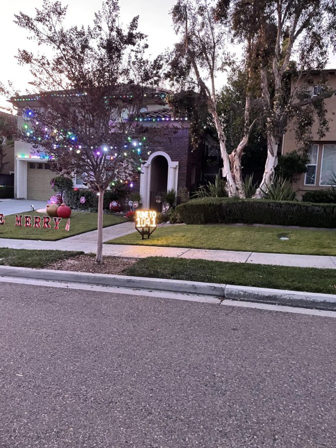 As cars pass by 6972 Ammonite Place, they are able to tune into a radio channel that is synced with the lights. One of the first houses on the court displays a neon sign that reads: “Tune to 104.1.”