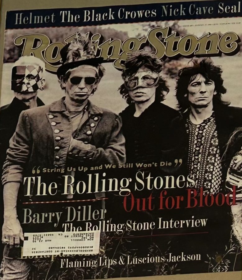 A featured photo of Rolling Stones Magazine is framed to preserve elements. Bands such as The Rolling Stones and The Black Crowes are represented on the front page feature.