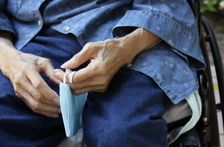 Evelyn Nagata loosely holds a surgical mask in her hands. Nagata recently turned 90 years old and has continued her work to chronicle her family’s history.