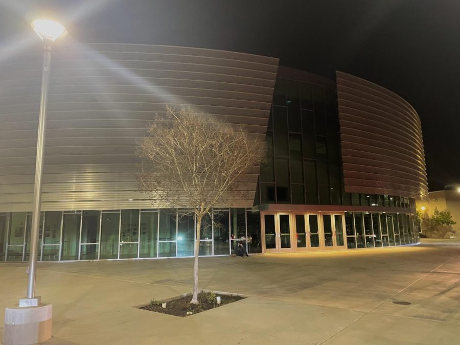 The front of the PAC glistens at night. The bridges will enhance the transportation and mobility on campus.