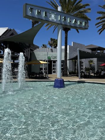  AVO Cafe sits on the other end of The Islands central waterfall. The sun out along with shimmering water, this is a beautiful day in Carlsbad, California.