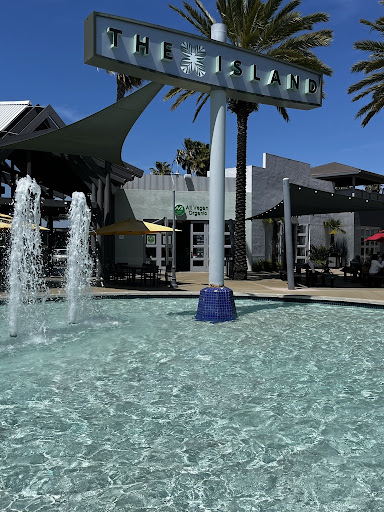  AVO Cafe sits on the other end of The Island's central waterfall. The sun out along with shimmering water, this is a beautiful day in Carlsbad, California.