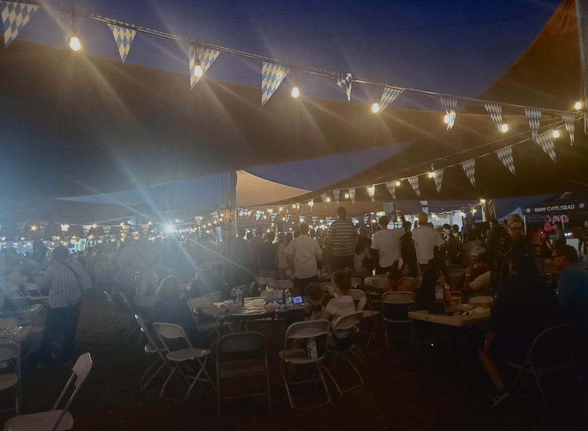 Oktoberfest goers eat, eat, drink and mingle in the biergarten. Tip Top Meats provided the catering for the event.