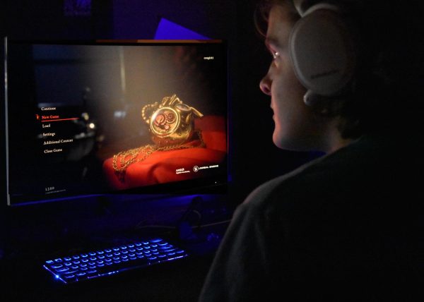 The player loads up the game. “Lies of P” came out on Sept. 18.