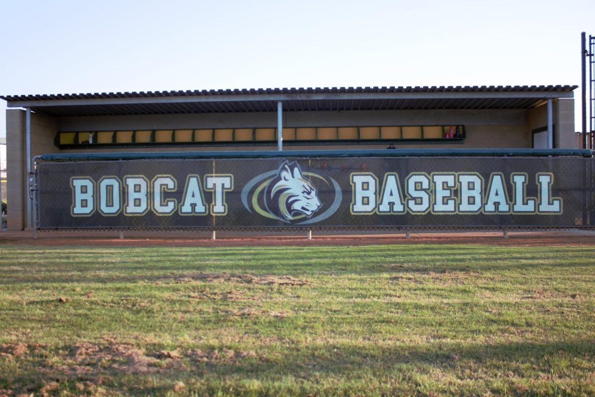 Bobcat Baseball fence in front of the dugout. The teams store all the essentials in the dugout for practices and games.