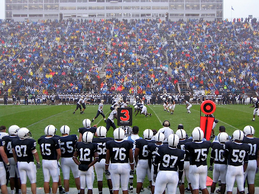 Penn State players watch as the game unfolds vs Akron Fans in the stands are hoping to see a big play.