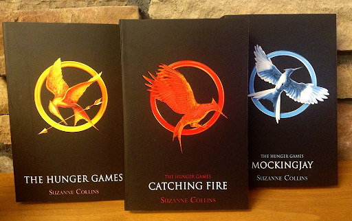 “The Hunger Games” Trilogy by Suzanne Collins is loved by teens for its dystopian fantasy plot. Fans love these books for the dramatic romance and the otherworldly universe it takes place in.