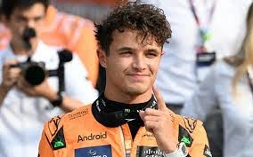 McLaren driver Lando Norris celebrates after securing pole position in qualifying for the Italian Grand Prix. He went on to take third place and finished 6.153 seconds behind the leader.