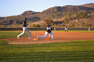 Kieren Lucas (10) a first baseman prevents a runner on Oceanside Pirates from reaching first base. Sage Creeks JV and Varsity baseball teams practice daily to ensure positive performance in the players.