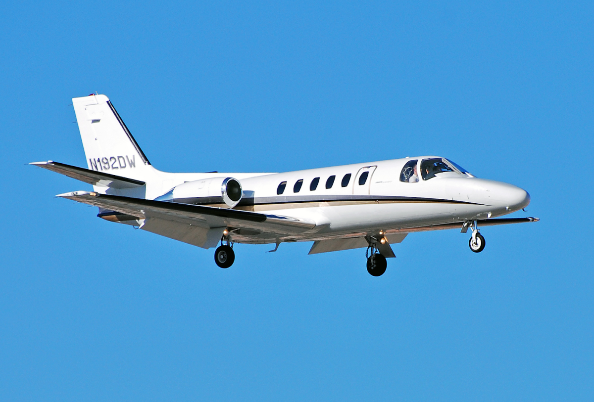 A Cessna 550 flies through clear skies. This was the plane that crashed into the San Diego military neighborhood. 