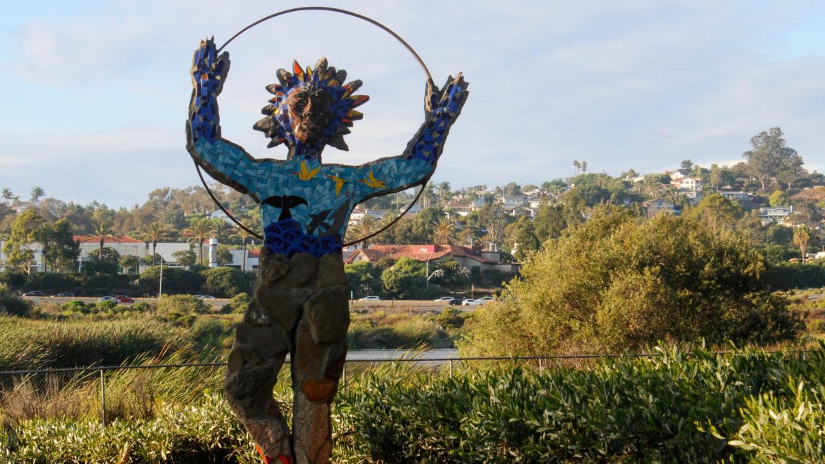 A colorful sculpture lies on the exterior of the park. Although the artist is unknown, it beautifully showcases the nearby lagoon with birds flying above its waters.