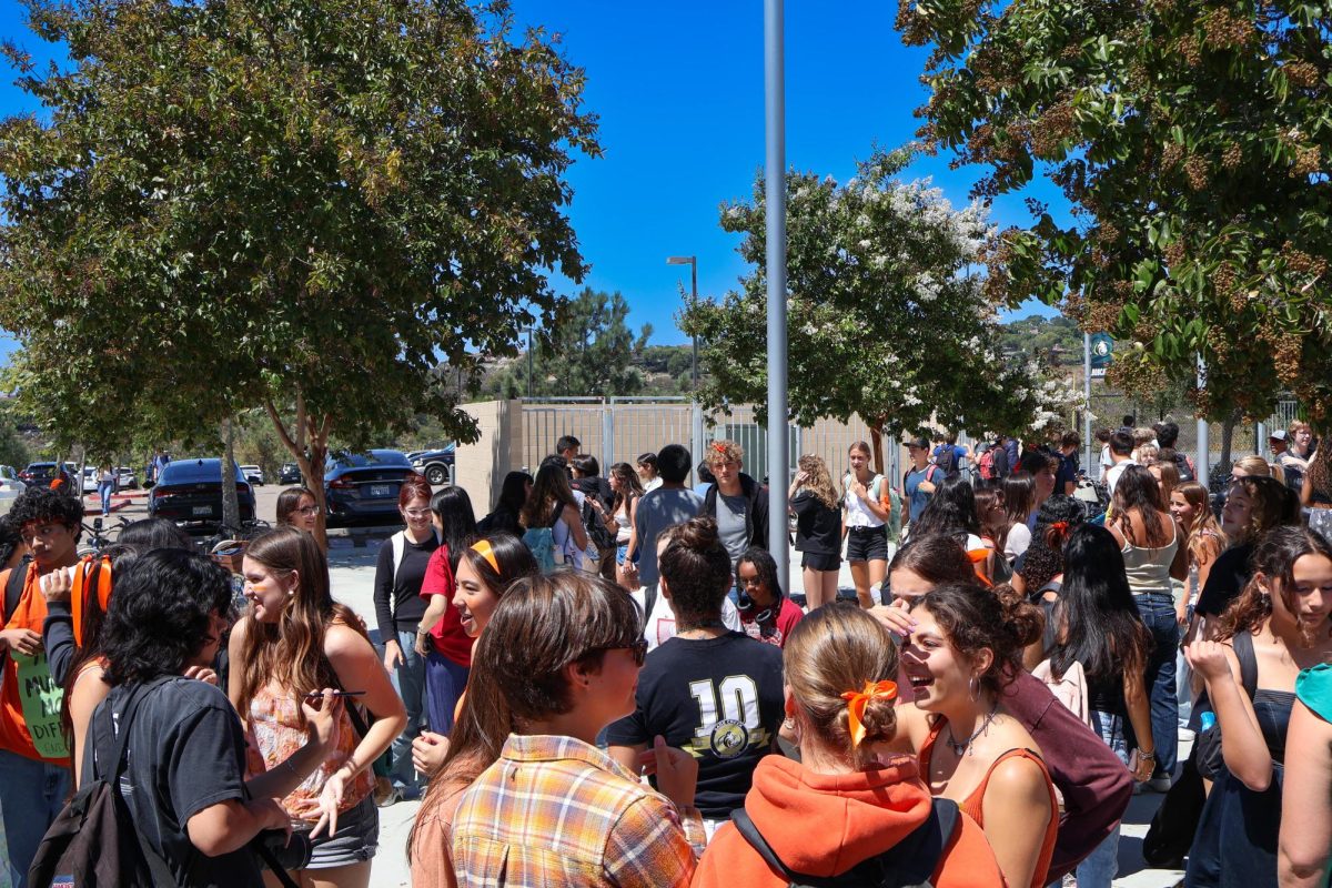 Students walked out of school at 12:00 p.m. on Sept. 5, 2025, in protest of school shootings and gun violence. They are seen wearing the color orange, which represents gun violence awareness and prevention.